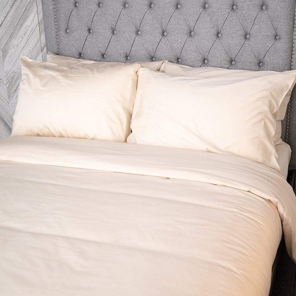 Bed featuring chalk washed sateen duvet cover