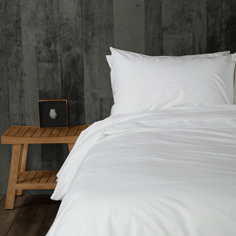 bed featuring white washed percale sheet set