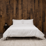 Bed featuring white washed sateen duvet cover