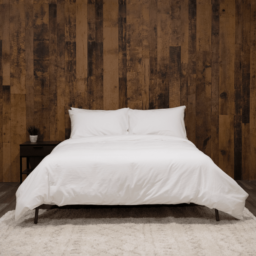 Bed featuring white washed sateen duvet cover