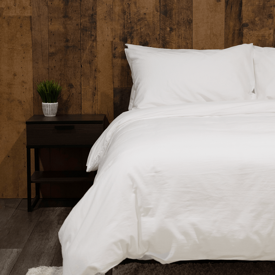 bed featuring white washed sateen pillowcases