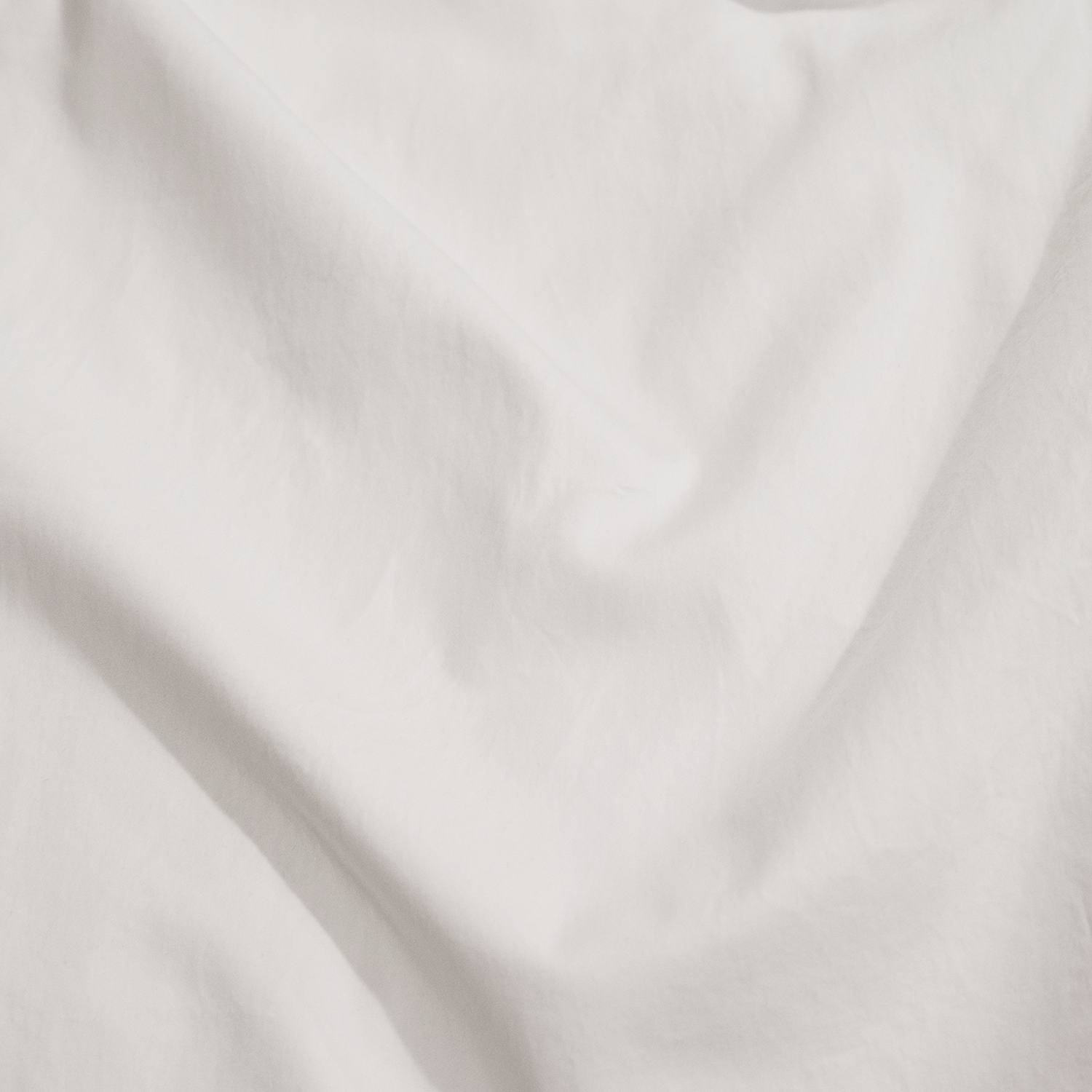 Close up of white washed sateen sheet set