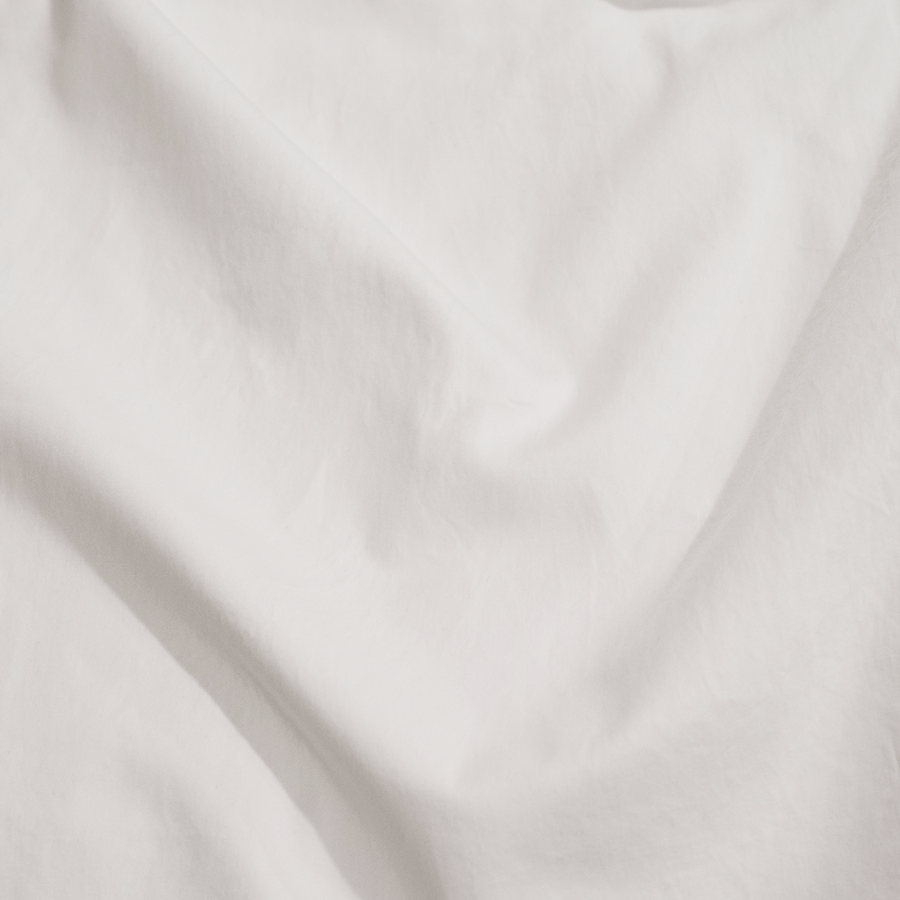 close up of white washed sateen duvet cover