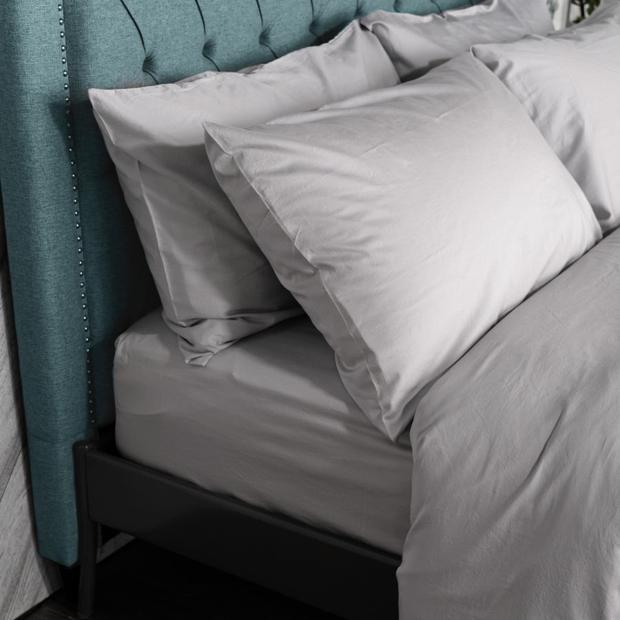 bed featuring light grey washed sateen sheet set