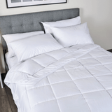 Flay lay of Down Alternative Duvet Blanket with Essential Pillows