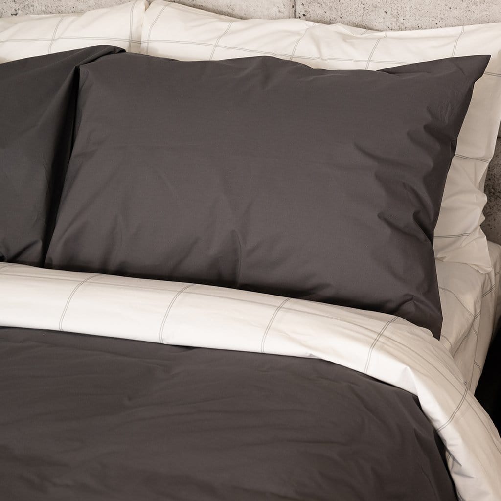Pillow Featuring Charcoal Percale Duvet Set and Light Grey Frame Sheet set 