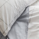 Close up of Light Grey Percale Sheet and Light Grey Frame Percale Duvet Cover