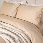 Bed featuring Refined sateen sheet set in frosted almond