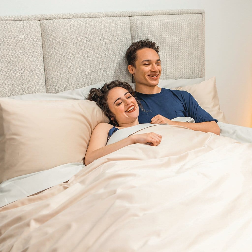 MAn and Woman in Bed Featuring Frosted Almond Refined Sateen Duvet Cover