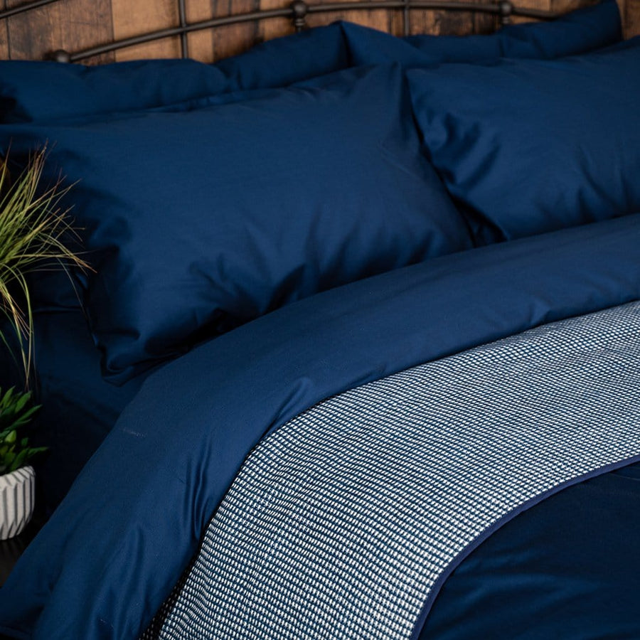 Bed featuring Navy refined Sateen Sheet set
