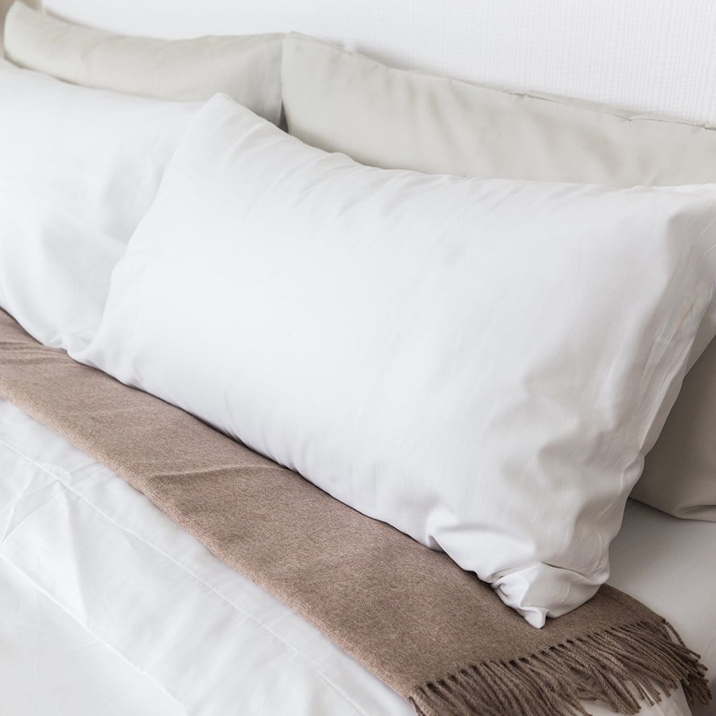 Pillow featuring refined sateen sheet set 