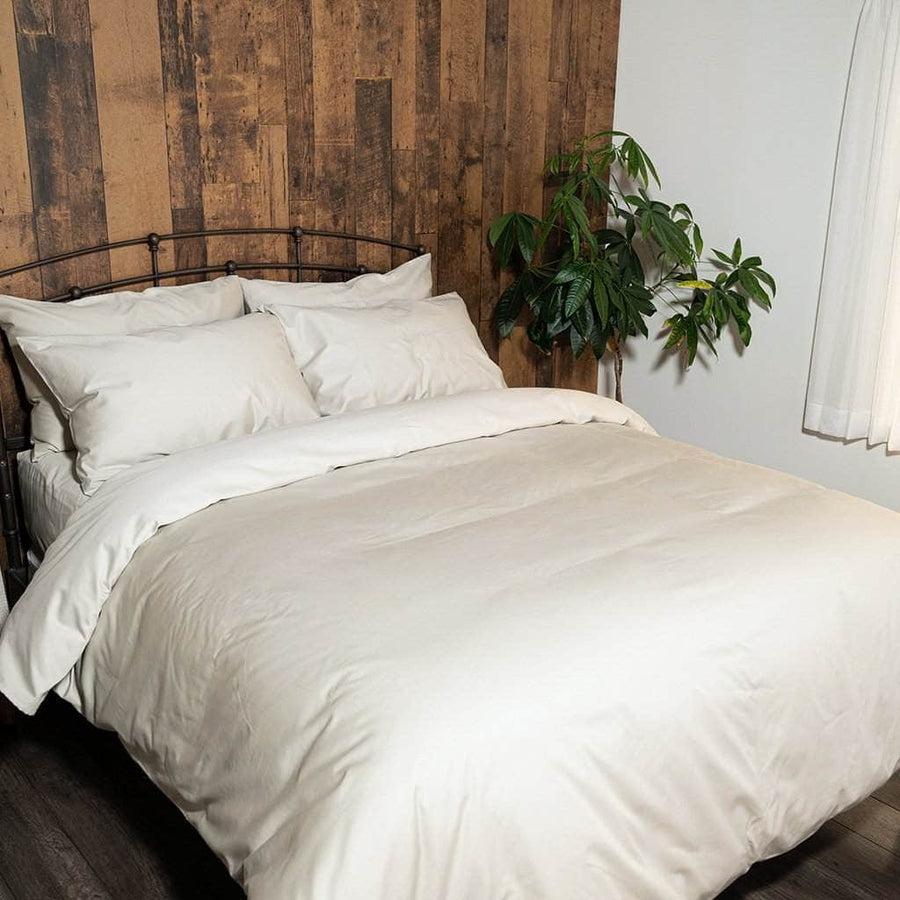 bed featuring refined sateen sand duvet set