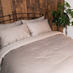 Bed featuring Refined Sateen sheet set in warm Grey 
