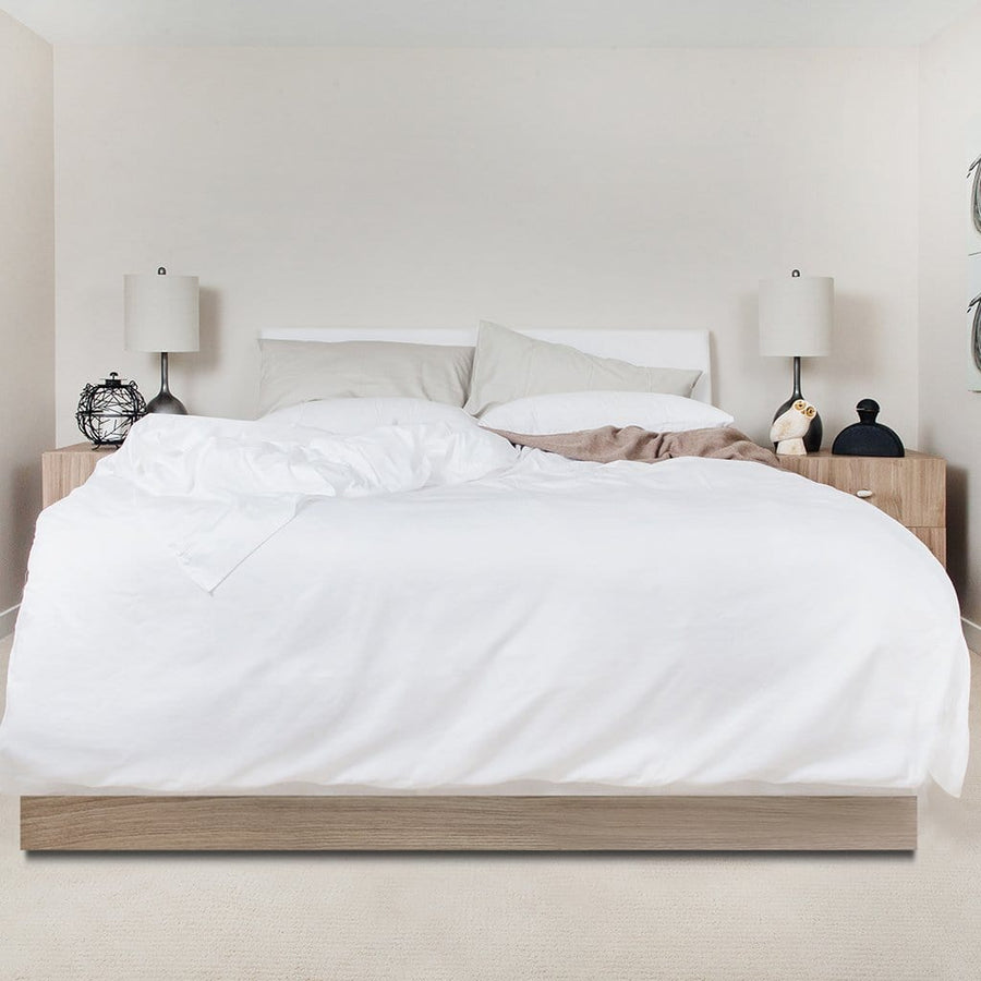 Bed featuring white refined sateen sheet set