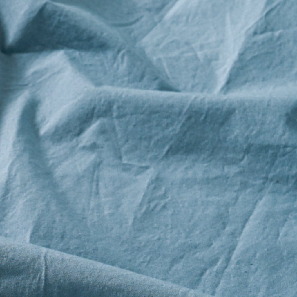 Close up of baltic sea washed percale sheet set