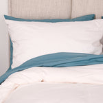 Bed featuring baltic sea washed percale sheet set