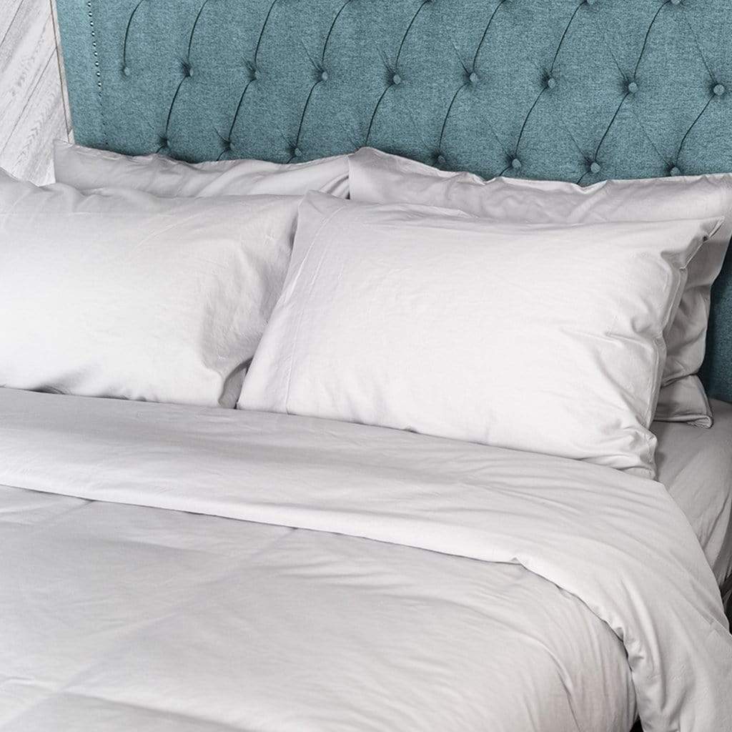 bed featuring light grey washed sateen sheet set